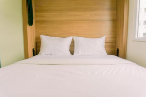 Minimalist and Best Deal 2BR Green Pramuka City Apartment By Travelio